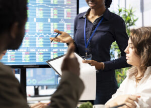 Advisory board members meeting in boardroom to establish future development plan Advisory board members meeting in boardroom to establish future development plan, ensuring expansion goals for the multinational company. Studying big data insights to make informed decisions.