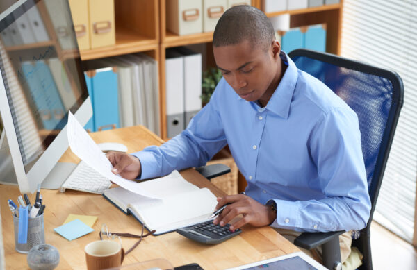 Businessman concentrated on work with financial document