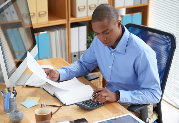 Businessman concentrated on work with financial document